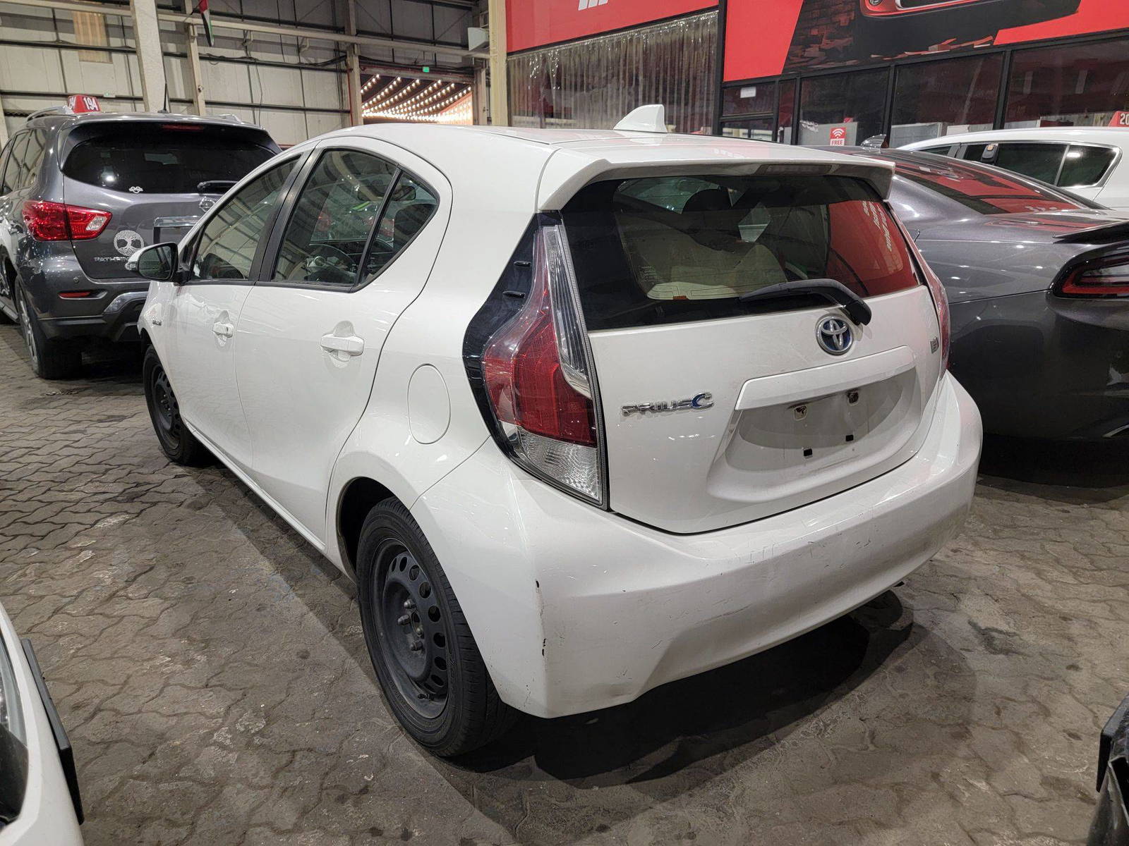 2015 TOYOTA PRIUS C — 303302 Miles — Lot 64455355 — Main - Marhaba Auctions Used Cars - Image 4