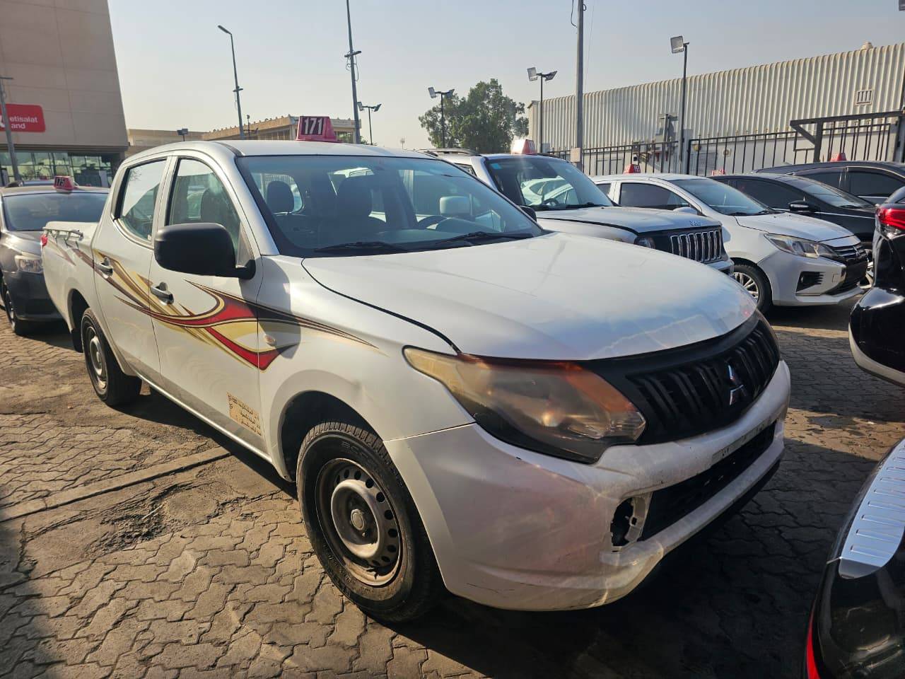 2018 MITSUBISHI pickup — 330053 KM — Lot G35HXJH0284 — Main - Marhaba Auctions Used Cars - Image 2