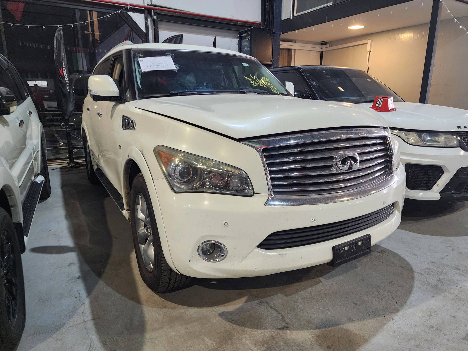 2014 INFINITI QX80 — 183312 Miles — Lot 43067639 — Ind. 12 - Marhaba Auctions Used Cars - Image 4