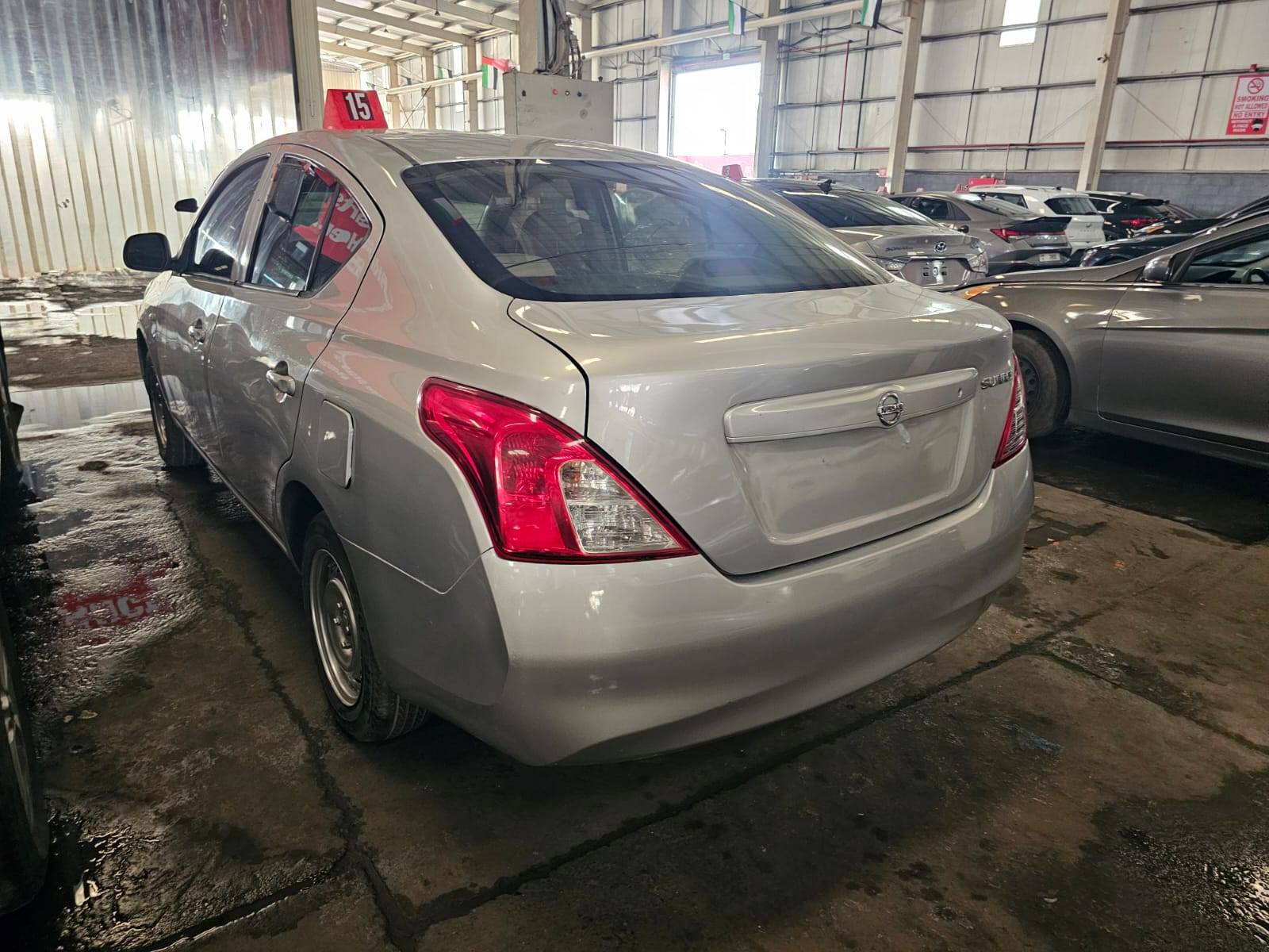 2013 NISSAN SUNNY — 303007 KM — Lot MDHBN7A — Main - Marhaba Auctions Used Cars - Image 2